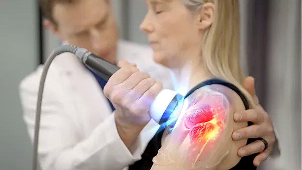 StemWave treatment device applied to a patient's shoulder